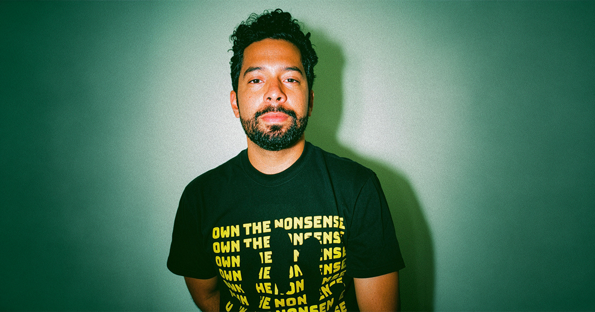 Sway Molina wearing a black graphic T-shirt